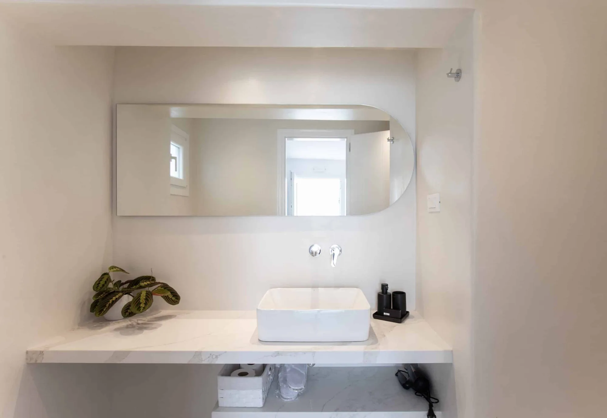 Bathroom basin with wide mirror